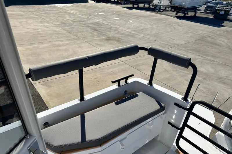 Slide: The Image of 2025 Sargo 31OB boat docked near a bridge, sunny day, clear sky. - 11