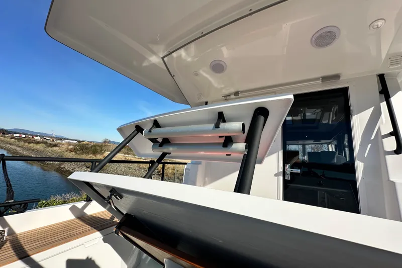 Slide: The Image of Sargo 31OB 2025 boat with open deck and modern design by the water. - 19