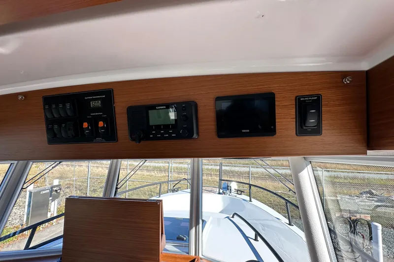 Slide: The Image of Control panel of 2025 Sargo 31OB boat with navigation and monitoring systems. - 25