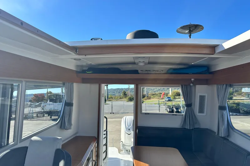 Slide: The Image of Interior of 2025 Sargo 31OB boat with seating and windows. - 29