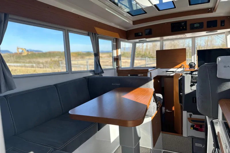 Slide: The Image of Interior of 2025 Sargo 31OB boat with modern seating and panoramic windows. - 34