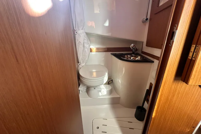 Slide: The Image of Compact bathroom in 2025 Sargo 31OB boat with toilet and sink. - 42