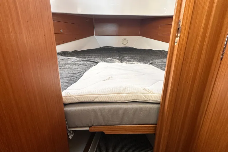 Slide: The Image of Cozy cabin interior of 2025 Sargo 31OB boat with comfortable bedding. - 46