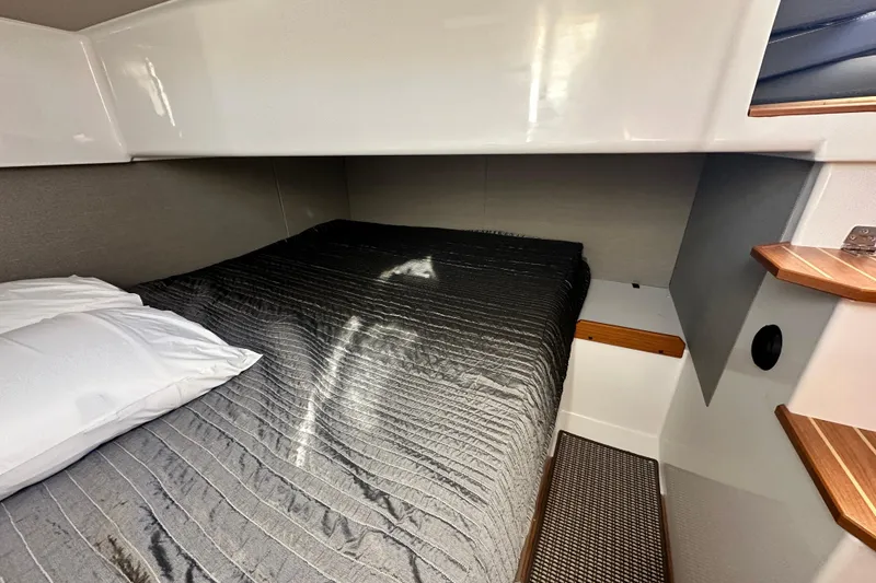 Slide: The Image of Cozy cabin interior of 2025 Sargo 31OB with comfortable bedding and modern design. - 49