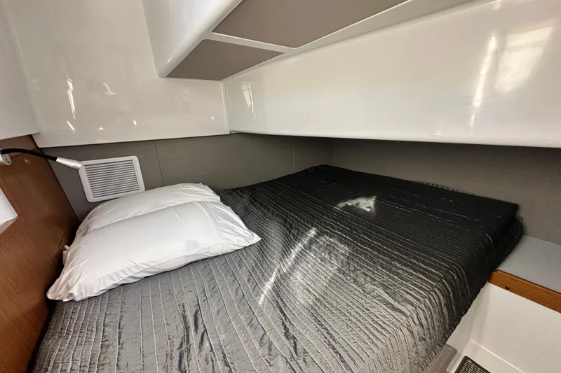 Slide: The Image of Cozy cabin interior of 2025 Sargo 31OB with a neatly made bed. - 55
