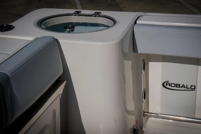Slide: The Image of 2025 Robalo R230 Center Console boat interior with seating and livewell. - 15