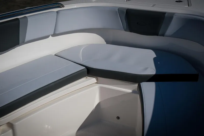 Slide: The Image of 2025 Robalo R230 Center Console boat seating area with cushioned seats. - 5