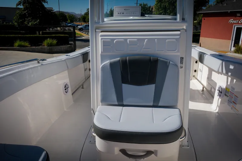 Slide: The Image of 2025 Robalo R230 Center Console boat interior with seating and sleek design. - 6