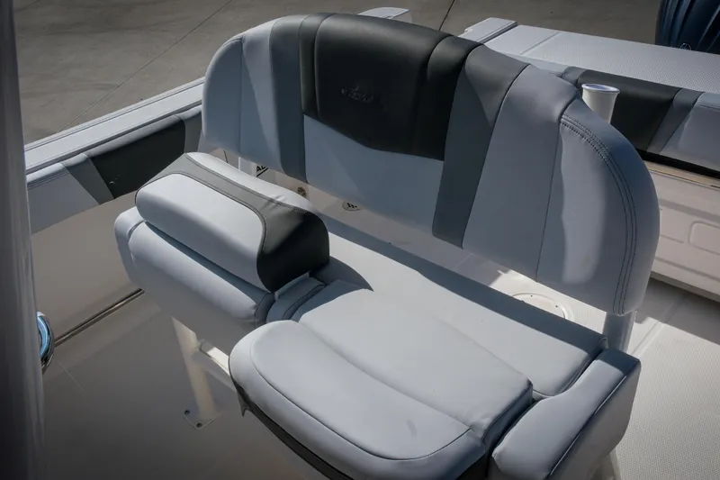Slide: The Image of 2025 Robalo R230 Center Console boat seat, featuring sleek gray and black upholstery. - 8
