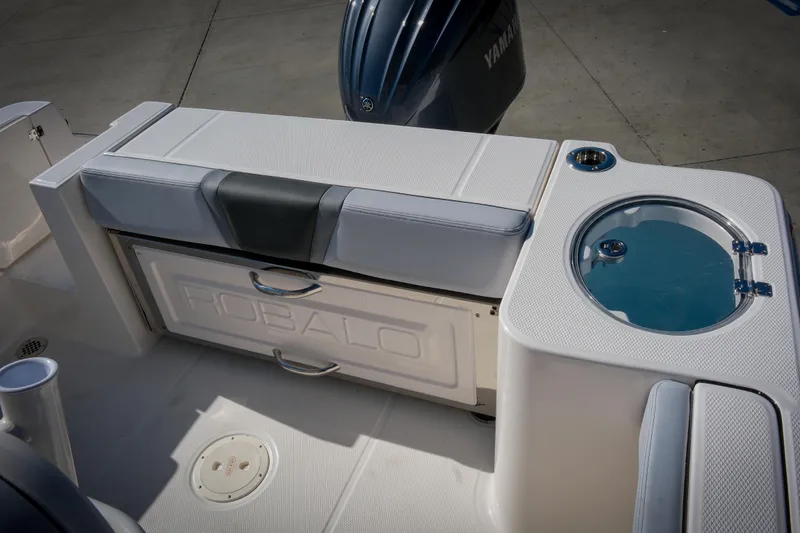 Slide: The Image of 2025 Robalo R230 Center Console boat interior with seating and storage features. - 9