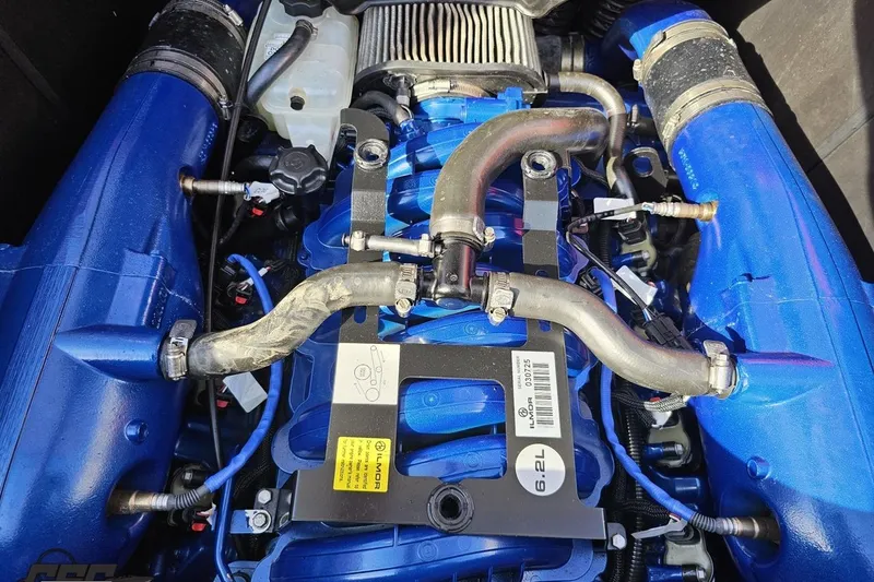 Slide: The Image of 2022 MasterCraft XT24 engine, featuring blue components and a 6.2L Ilmor engine label. - 104