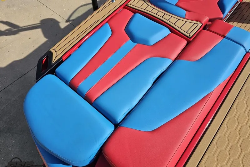 Slide: The Image of Red and blue seating on 2022 MasterCraft XT24 boat, showcasing modern design. - 37