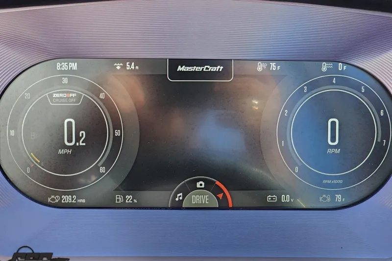 Slide: The Image of Digital dashboard of a 2022 MasterCraft XT24 boat displaying speed, RPM, and temperature. - 74