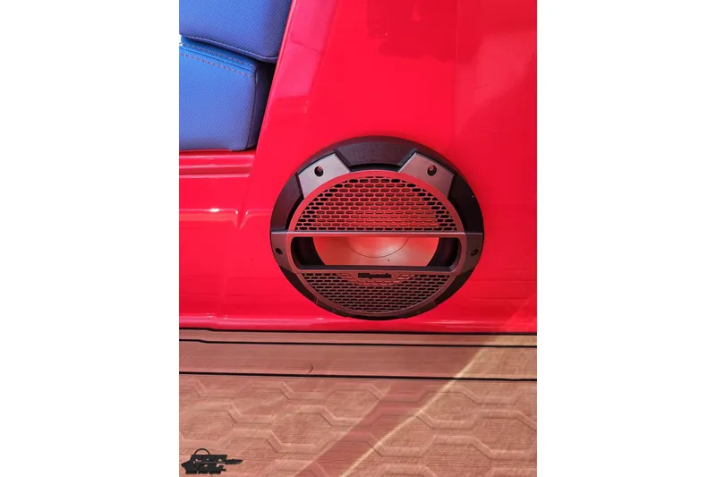 Slide: The Image of Red MasterCraft XT24 2022 boat speaker with blue seat and wooden floor. - 80