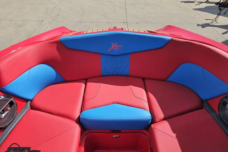 Slide: The Image of Red and blue seating in 2022 MasterCraft XT24 boat, showcasing modern design. - 81