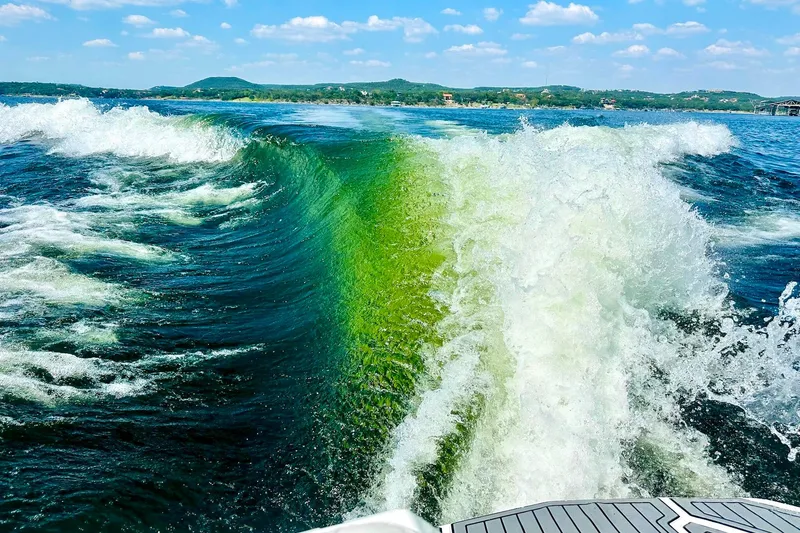 Slide: The Image of Wake created by a 2017 Nautique Super Air Nautique G23 on a sunny lake. - 12