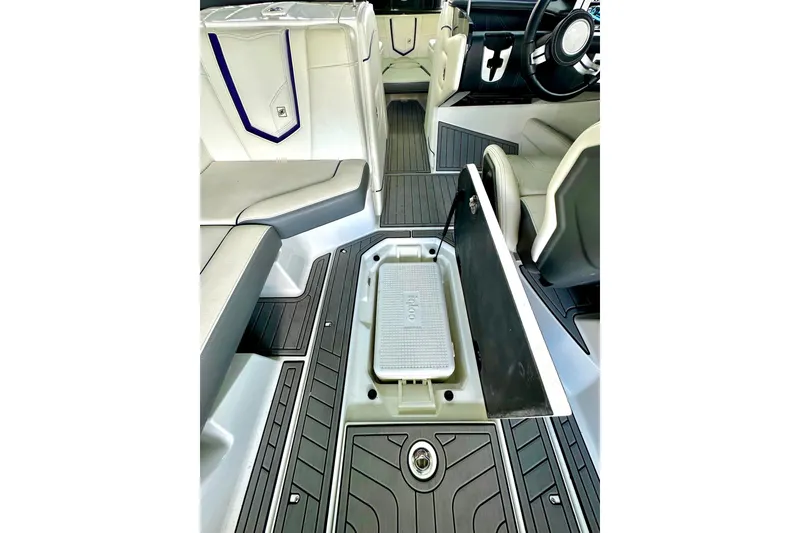 Slide: The Image of 2017 Nautique Super Air Nautique G23 interior with open storage compartment. - 30
