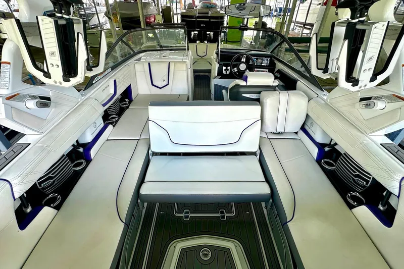 Slide: The Image of 2017 Nautique Super Air Nautique G23 interior with luxurious seating and modern dashboard. - 31
