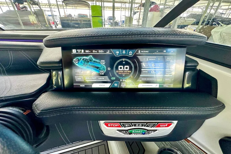 Slide: The Image of 2017 Nautique Super Air Nautique G23 dashboard with digital display and control panel. - 34