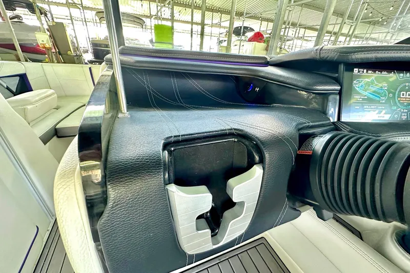 Slide: The Image of 2017 Nautique Super Air Nautique G23 dashboard with touchscreen and leather details. - 35