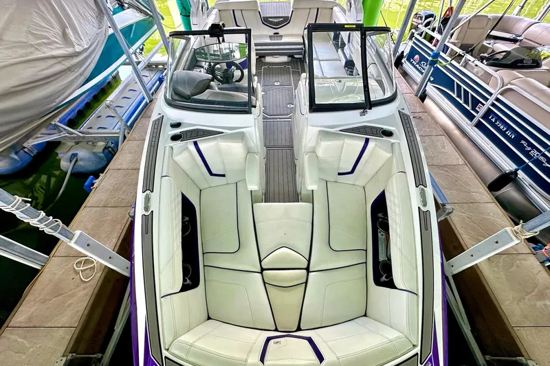 Slide: The Image of 2017 Nautique Super Air Nautique G23 boat interior with white seating and sleek design. - 38