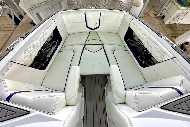 Slide: The Image of Luxurious interior of a 2017 Nautique Super Air Nautique G23 boat with white seating. - 39