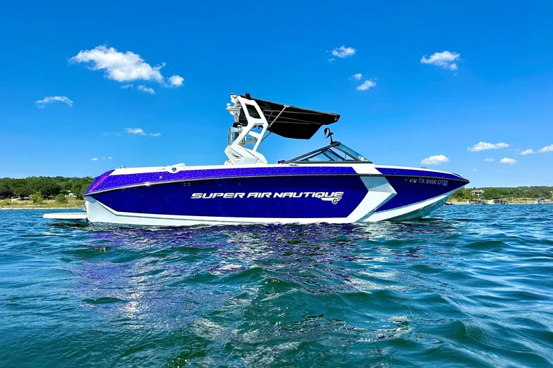 Slide: The Image of 2017 Nautique Super Air Nautique G23 boat on a sunny lake. - 5