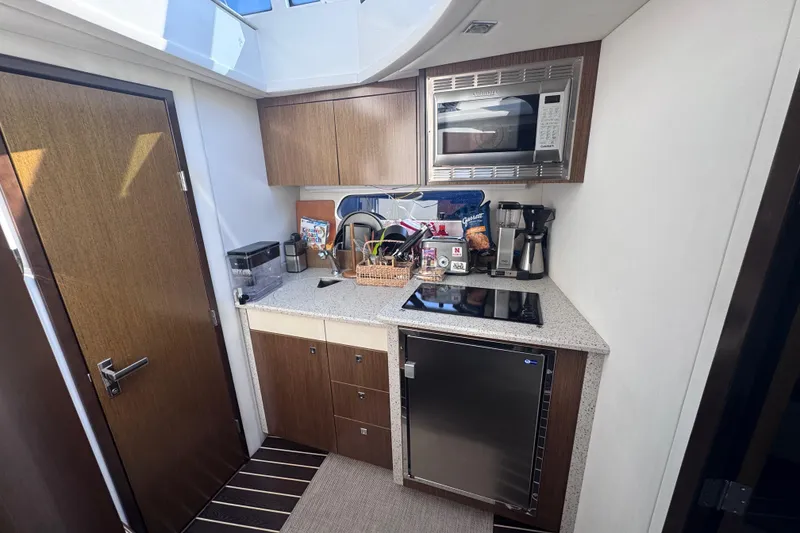 Slide: The Image of Modern kitchen in 2012 Cruisers Yachts 41 Cantius with appliances and storage. - 23