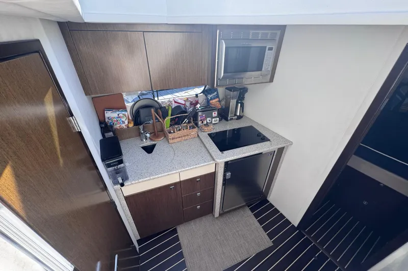 Slide: The Image of 2012 Cruisers Yachts 41 Cantius galley with modern appliances and sleek cabinetry. - 40