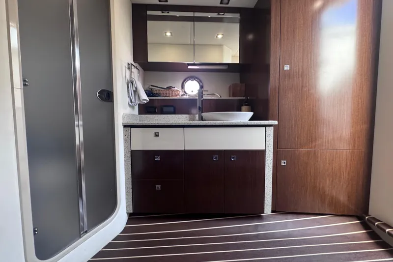 Slide: The Image of Interior of 2012 Cruisers Yachts 41 Cantius, featuring modern cabinetry and sleek design. - 55