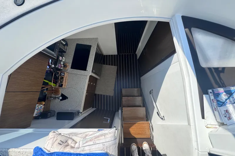 Slide: The Image of Interior view of 2012 Cruisers Yachts 41 Cantius, featuring modern kitchen and steps. - 42