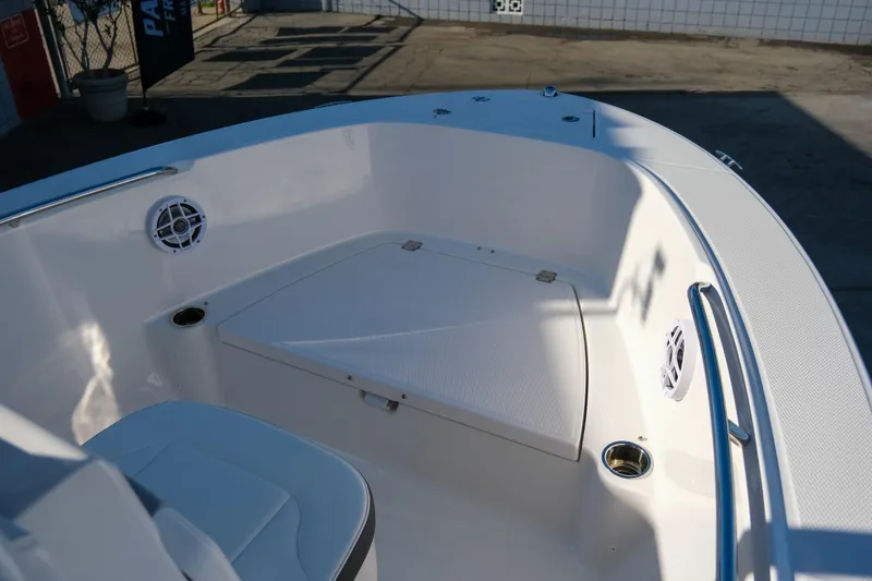 Slide: The Image of 2025 Robalo R180 Center Console boat interior with seating and cup holders. - 10