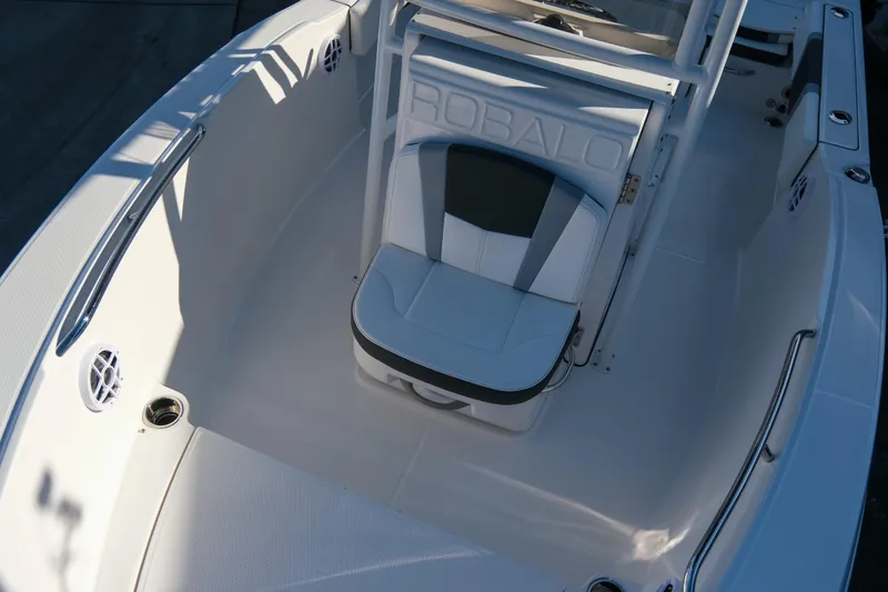 Slide: The Image of 2025 Robalo R180 Center Console boat interior with seating and console details. - 11