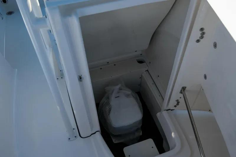 Slide: The Image of 2025 Robalo R180 Center Console boat interior storage compartment. - 12