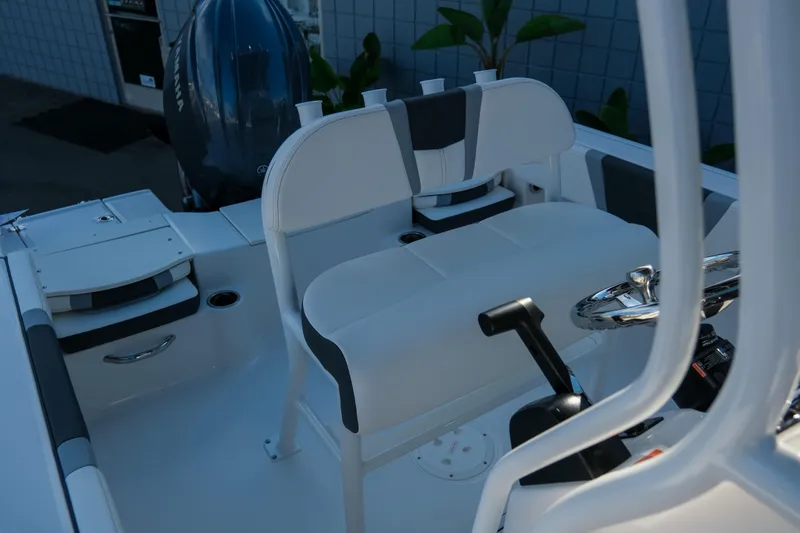 Slide: The Image of 2025 Robalo R180 Center Console boat interior with steering wheel and seating. - 14