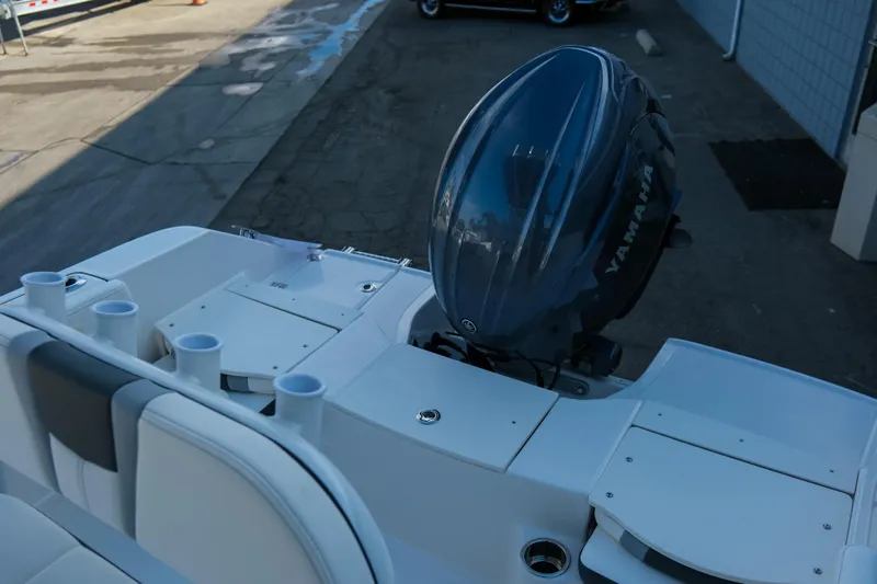 Slide: The Image of 2025 Robalo R180 Center Console boat with Yamaha outboard motor, docked. - 8