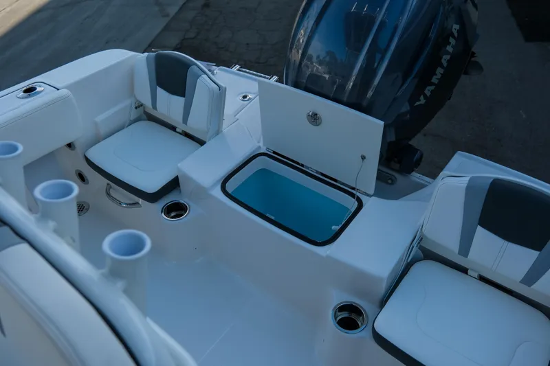 Slide: The Image of 2025 Robalo R180 Center Console boat interior with seating and storage compartments. - 9