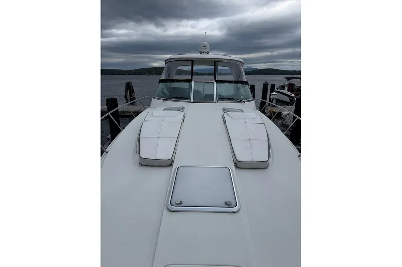Slide: The Image of 2019 Formula 37 Performance Cruiser docked under cloudy skies. - 14