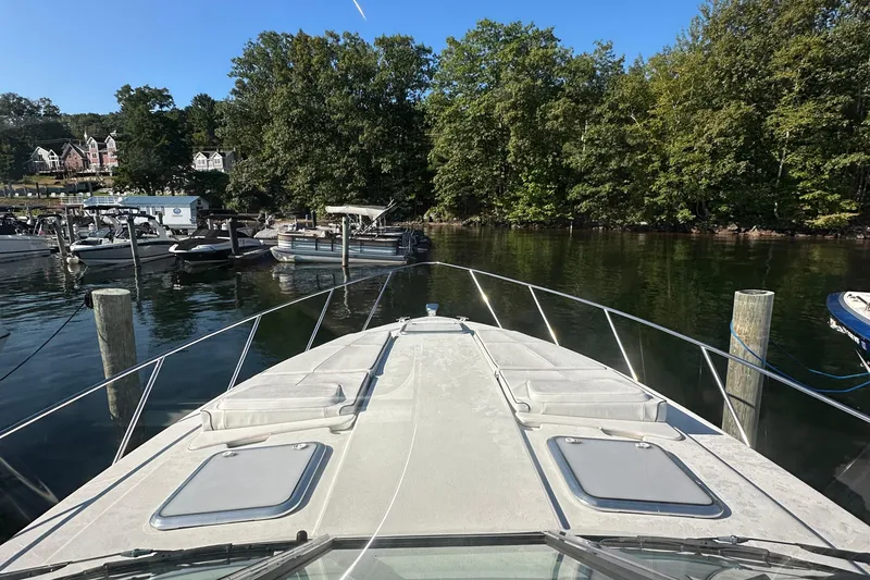 Slide: The Image of 2019 Formula 37 Performance Cruiser docked in a scenic marina setting. - 15