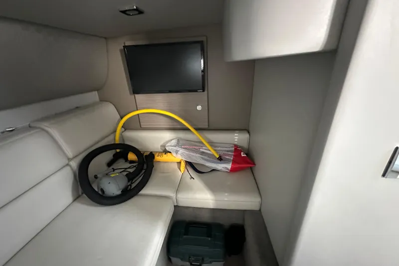 Slide: The Image of Interior of 2019 Formula 37 Performance Cruiser with TV and equipment on white seating. - 22