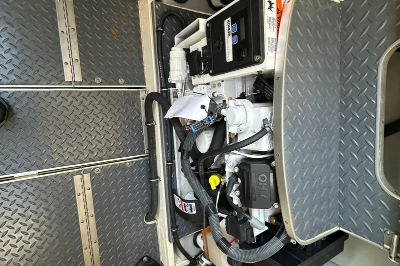 Slide: The Image of Engine compartment of a 2019 Formula 37 Performance Cruiser with visible components and wiring. - 24