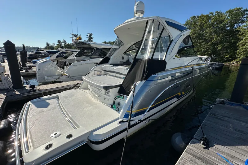 Slide: The Image of 2019 Formula 37 Performance Cruiser docked at marina, sunny day, sleek design. - 4