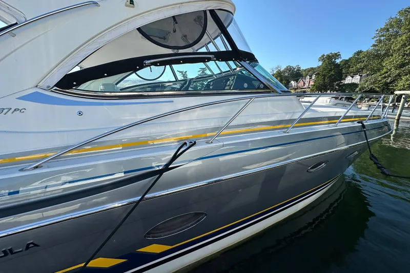 Slide: The Image of 2019 Formula 37 Performance Cruiser docked on a sunny day, showcasing sleek design. - 5