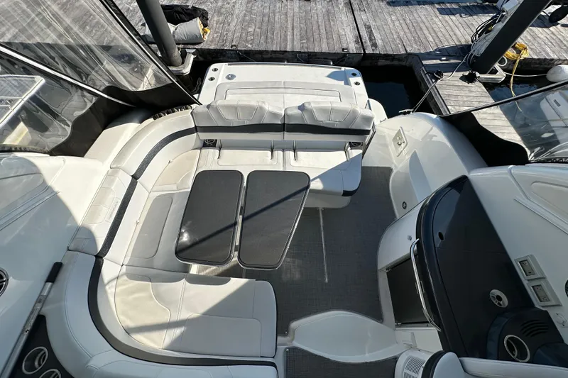 Slide: The Image of 2019 Formula 37 Performance Cruiser interior with seating and table, docked at marina. - 6