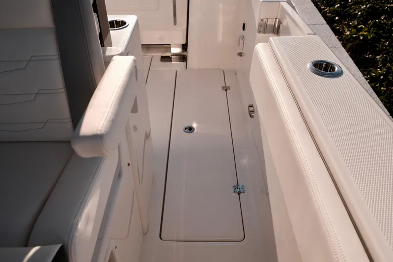 Slide: The Image of 2024 Robalo R360 Center Console interior with seating and cup holders. - 13