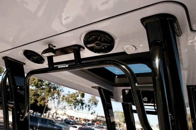 Slide: The Image of 2024 Robalo R360 Center Console boat interior with speakers and lighting fixtures. - 21