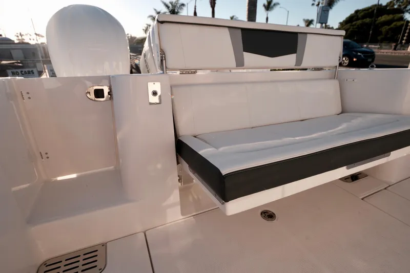 Slide: The Image of 2024 Robalo R360 Center Console boat with sleek seating and modern design. - 24