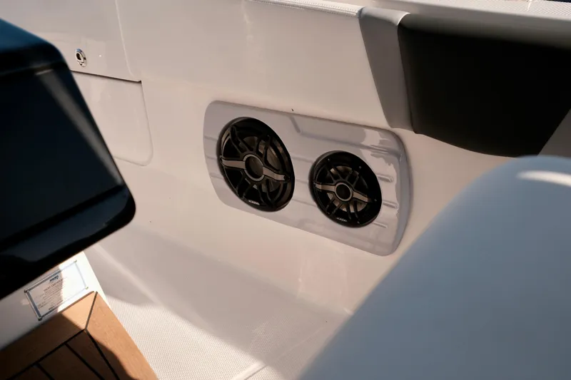 Slide: The Image of 2024 Robalo R360 Center Console boat interior with dual speakers. - 30