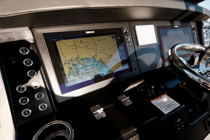 Slide: The Image of 2024 Robalo R360 Center Console dashboard with navigation display and controls. - 31