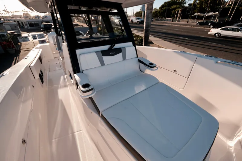 Slide: The Image of 2024 Robalo R360 Center Console boat interior with luxurious seating and modern design. - 38